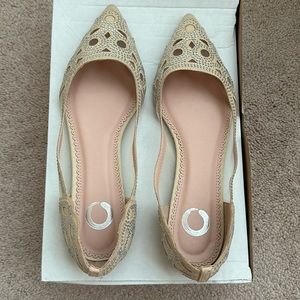 Sparkly tan flats.